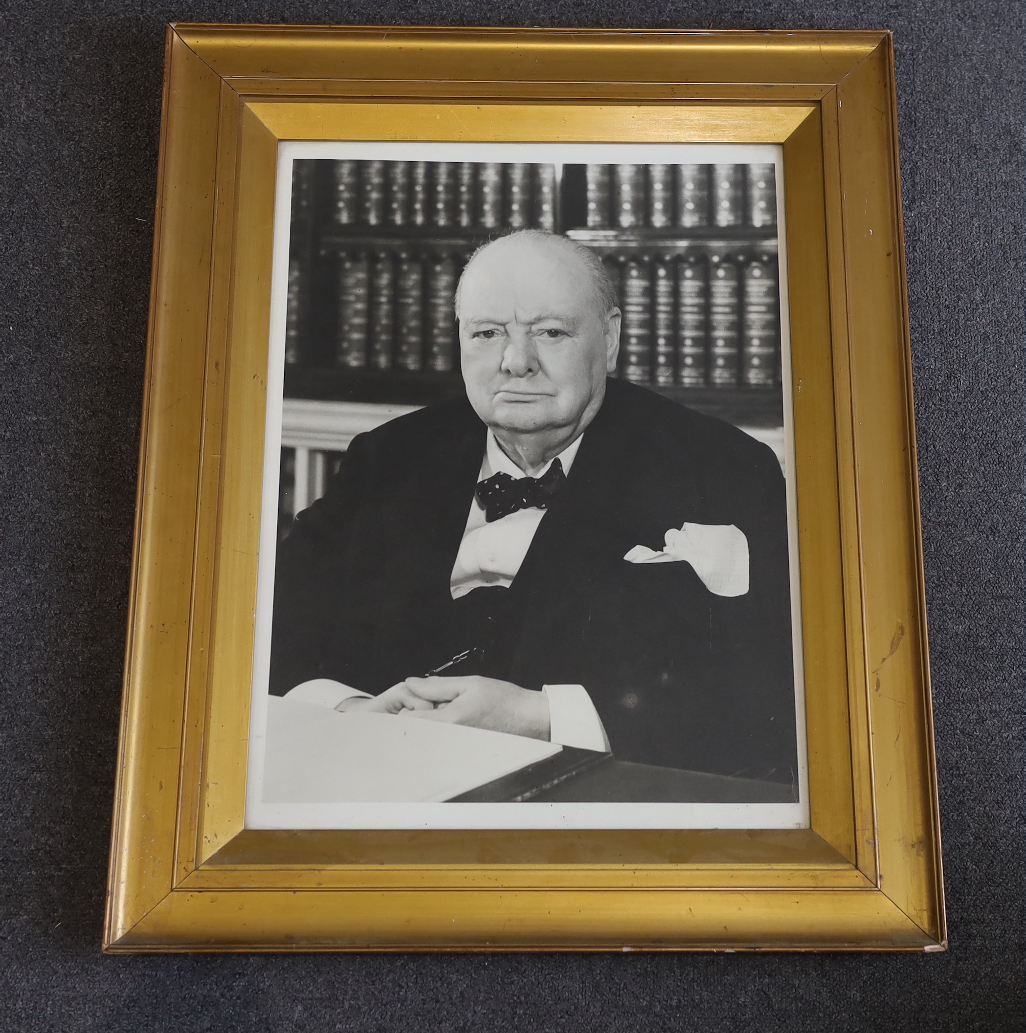 A large black and white photograph of Sir Winston Churchill seated at his desk, visible sheet 58 x 42.5cm